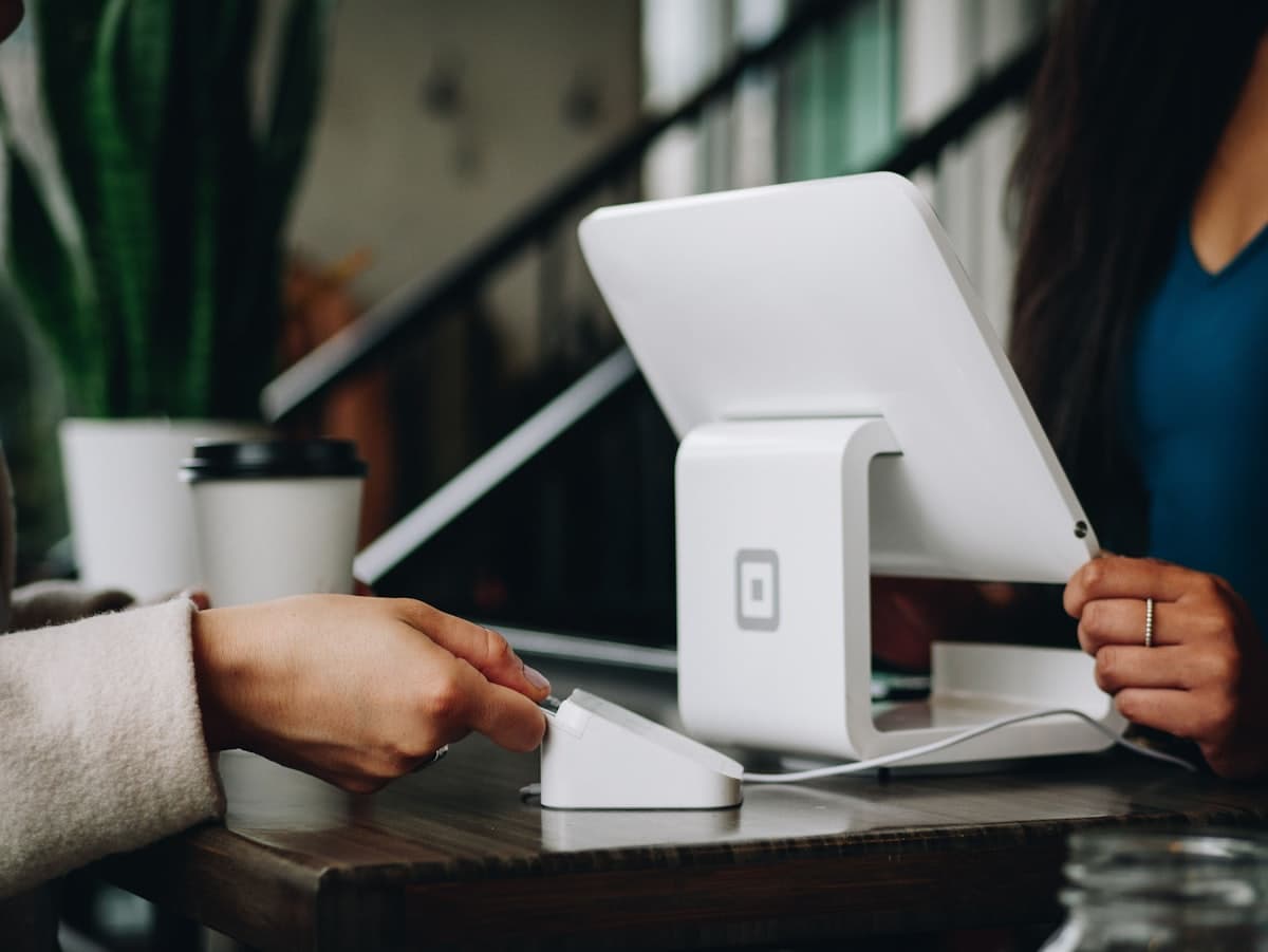 A small business owner completing a transaction with a customer